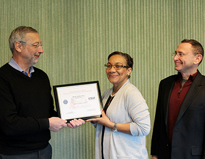 ENSCO President Boris Nejikovsky, left, receives a Patriot Award from Geambro Hollis, Virginia Area Chair, ESCR, and nominating officer Dr. Scott Goldstein.